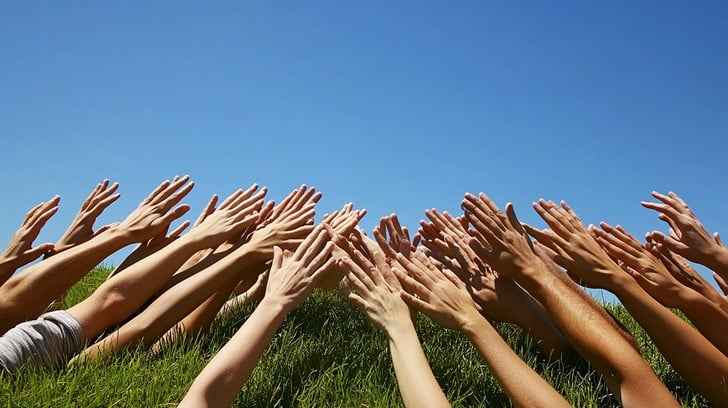 Hands reaching sky