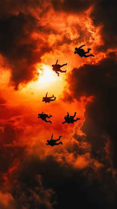 Skydivers at Sunset Skydivers at Sunset